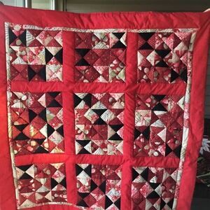 NWT Hand Crafted Red, Black, Gold and Tan Prints Quilt with Red Borders